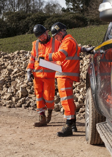 Two project managers reviewing plans